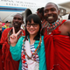 A Chinese tourist poses with traditional Kenyan Masaai dancers upon her arrival with a China Southern Airline plane at Jomo Kenyatta International Airport in Nairobi.